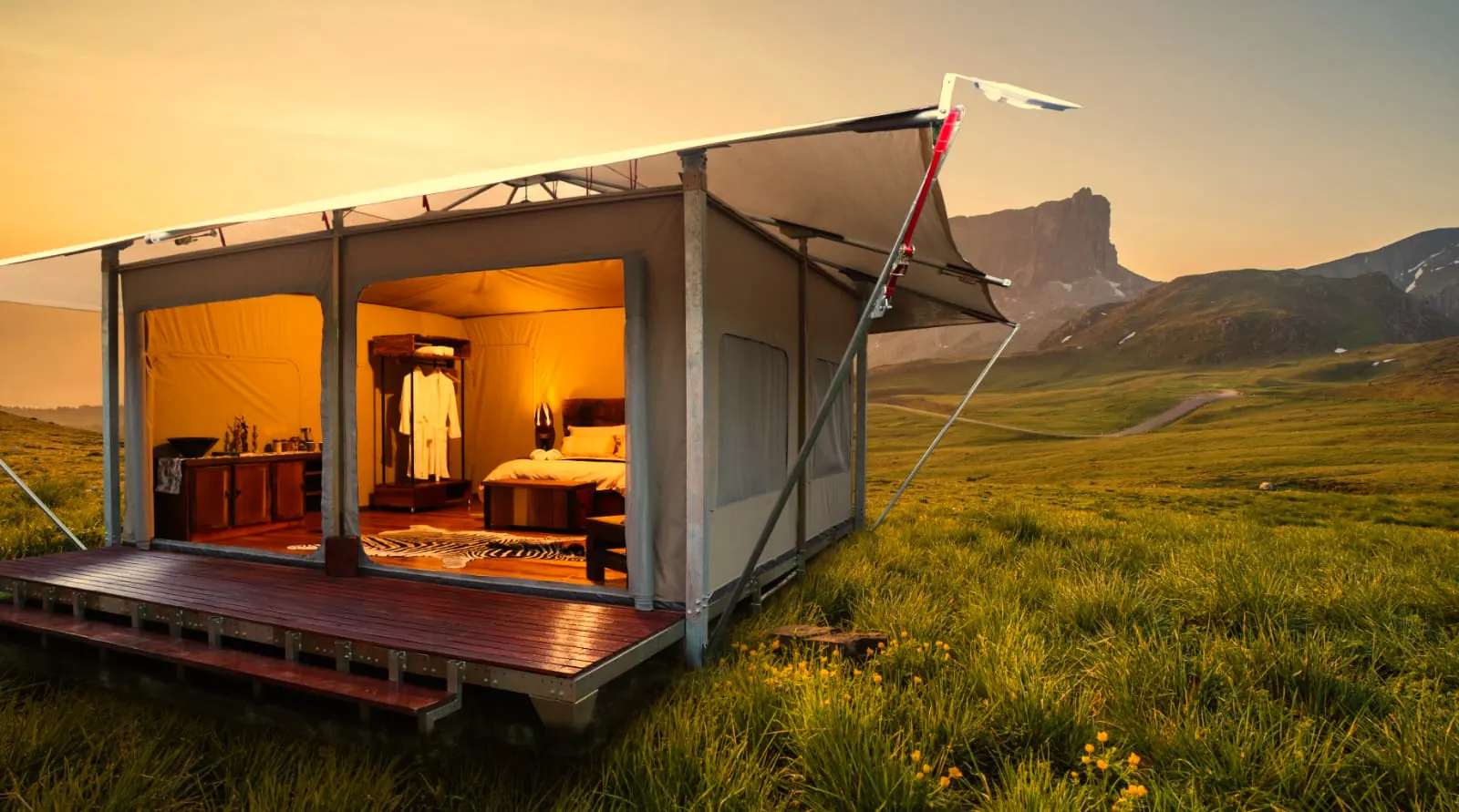 ARMIS safari tent with open canvas front on a raised deck in grassland